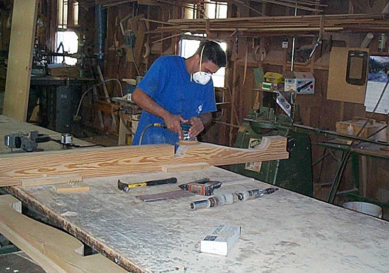 Wood Rafter Tails being sanded in shop